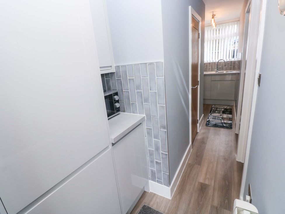A kitchen with cabinets and sink at 3 Devon Court Pembroke