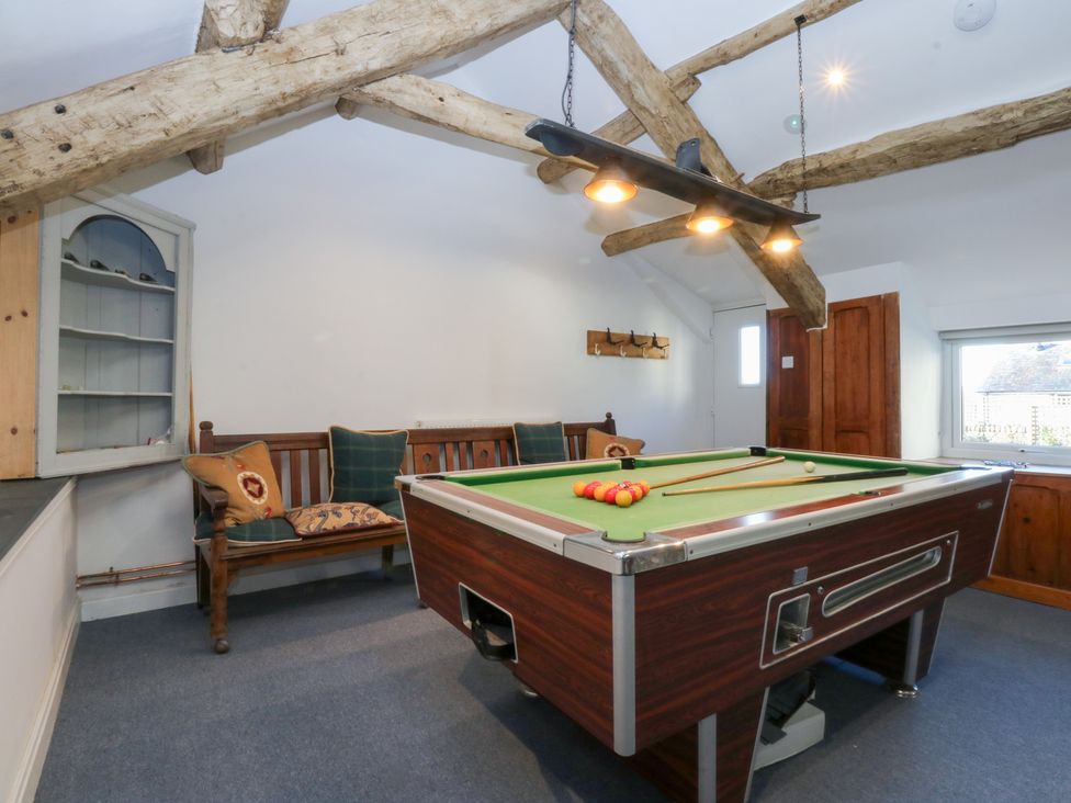 A games room with a pool table and a sofa at Yr Hen Felin in Dyffryn Ardudwy