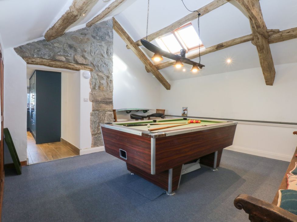 A recreational room with a pool table and skylight at Yr Hen Felin Dyffryn Ardudwy