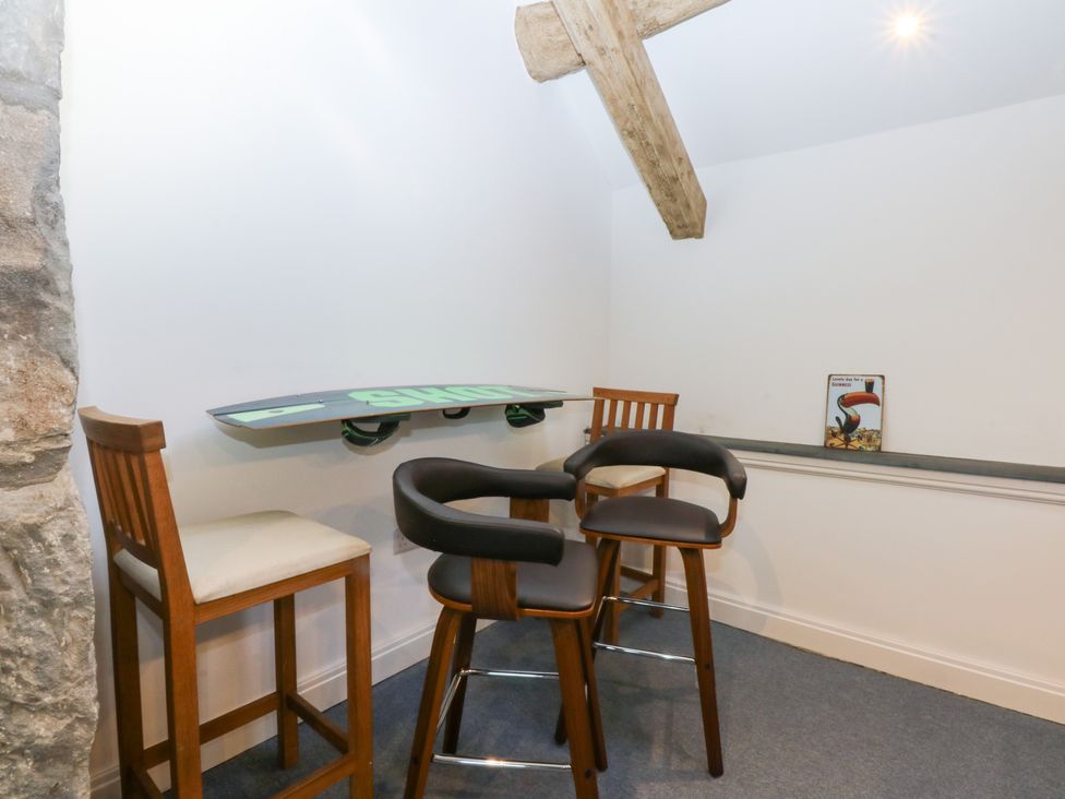 A snug with a bar table and stools at Yr Hen Felin Dyffryn Ardudwy