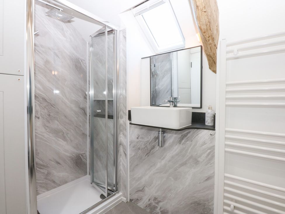 A bathroom with a shower and sink at Yr Hen Felin Dyffryn Ardudwy