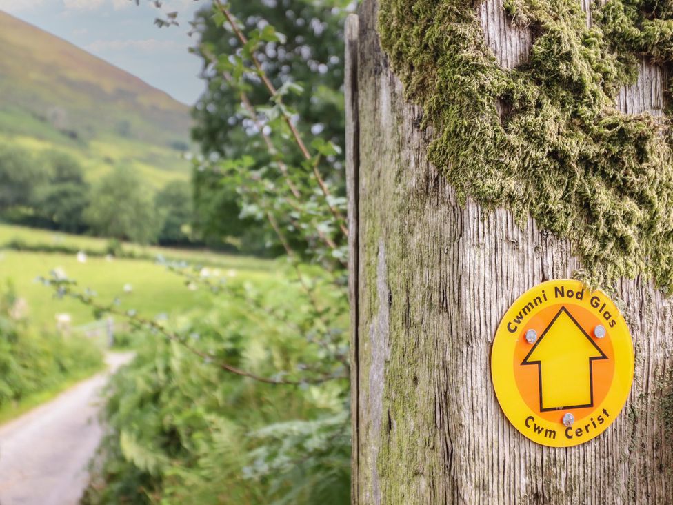 A signpost indicating the path at Cwm Nod Glas in Dinas Mawddwy near Dolgellau