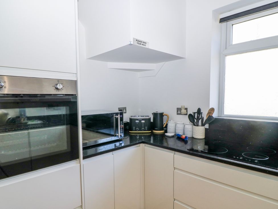 A kitchen with appliances and utensils at The Swanage Rail Lookout in Swanage