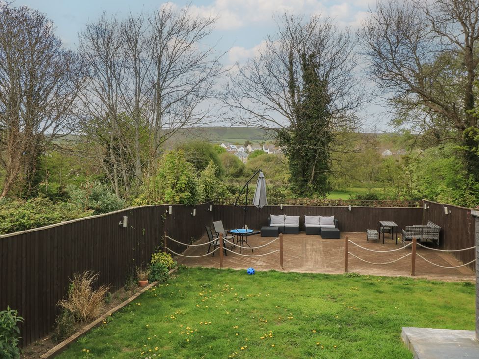 A garden with outdoor furniture and grass at The Swanage Rail Lookout in Swanage