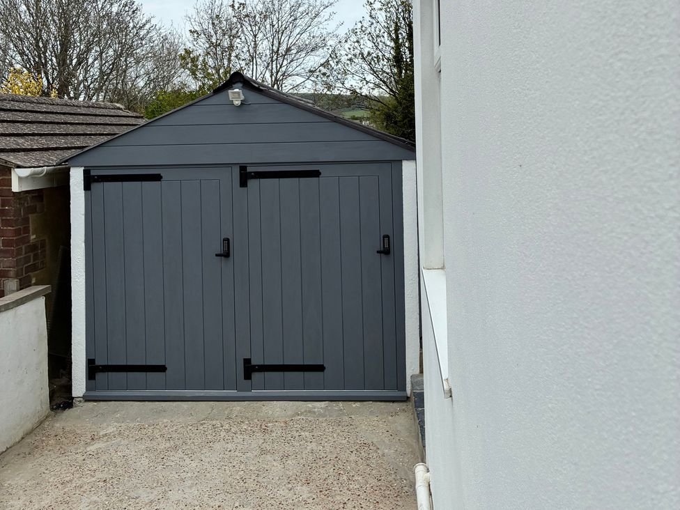 A shed with two doors and a light fixture at The Swanage Rail Lookout in Swanage
