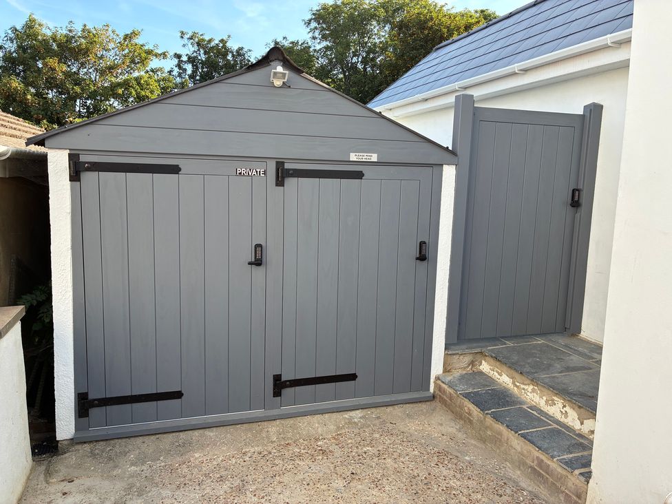 A shed and gate in an outdoor space at The Swanage Rail Lookout in Swanage