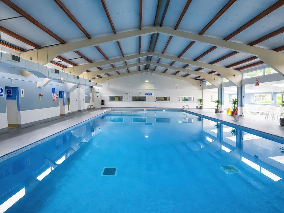 An indoor pool area with a swimming pool at Chalet 58 - The Beach House Kingsdown