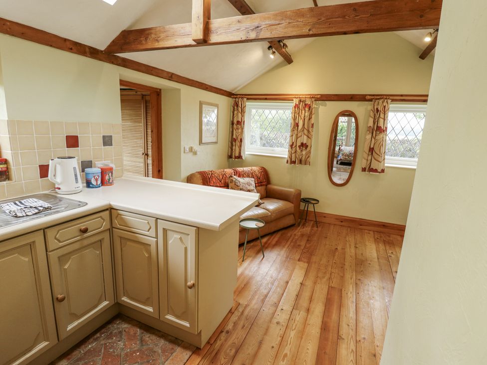 A kitchen with a sofa and a table at Pendockie in Boston