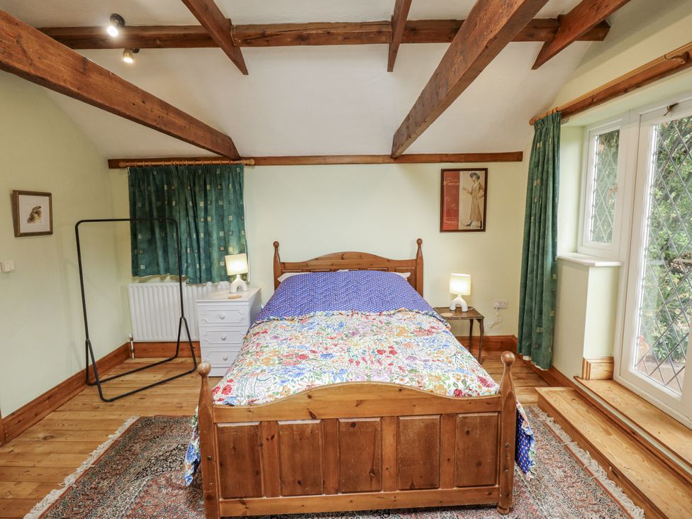 A bedroom with a bed and bedside table at Pendockie in Boston