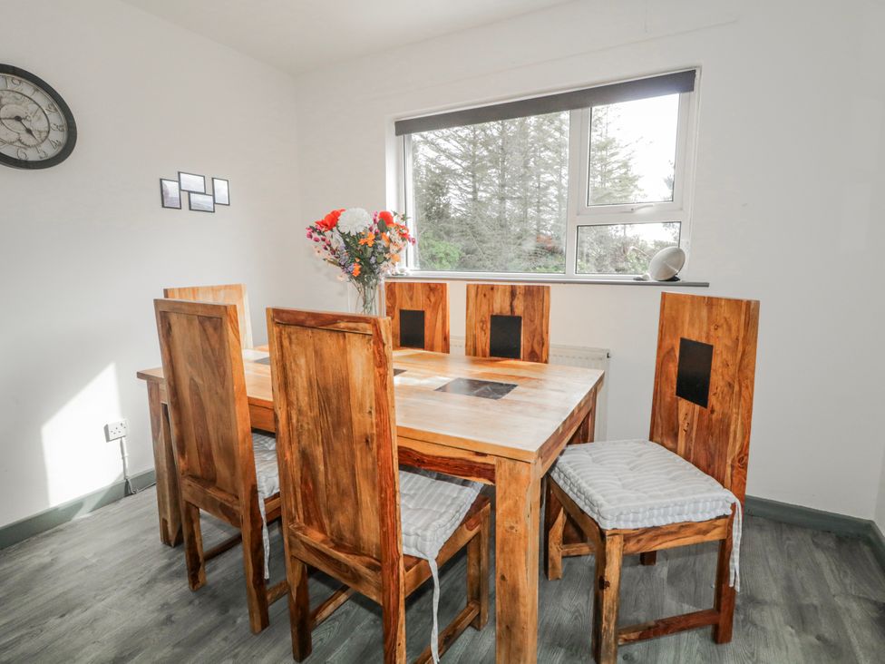 A dining room with a table and chairs at The Island's View in Gortahork, County Donegal
