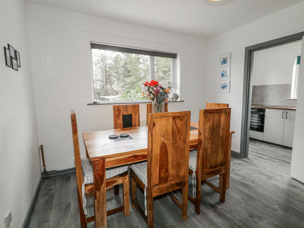 A dining room with a dining table and chairs at The Island's View in Gortahork, County Donegal