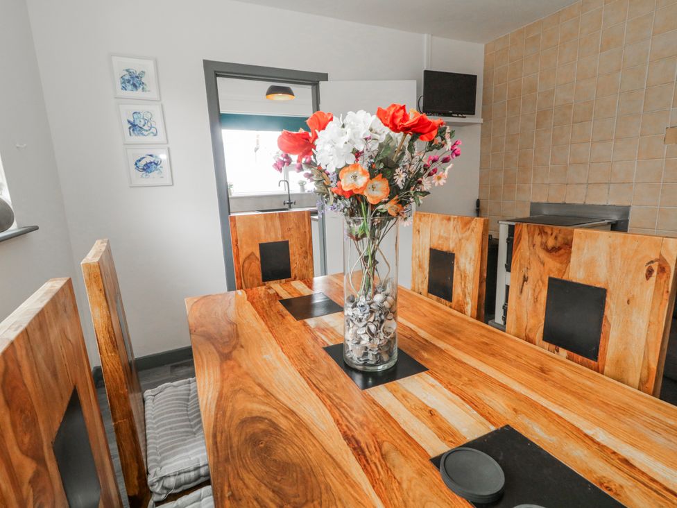 A dining room with a wooden table and chairs at The Island's View in Gortahork, County Donegal