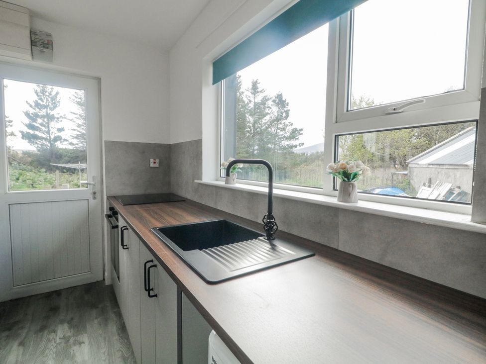 A kitchen with a sink and window at The Island's View in Gortahork, County Donegal