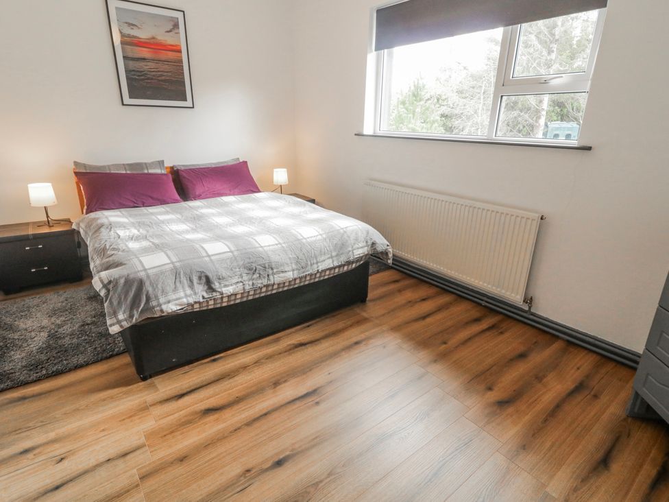 A bedroom with a bed and side tables at The Island's View in Gortahork, County Donegal