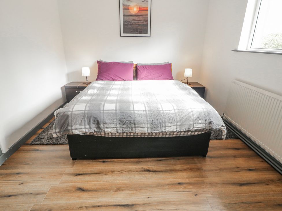 A bedroom with a double bed and nightstands at The Island's View, Gortahork, County Donegal