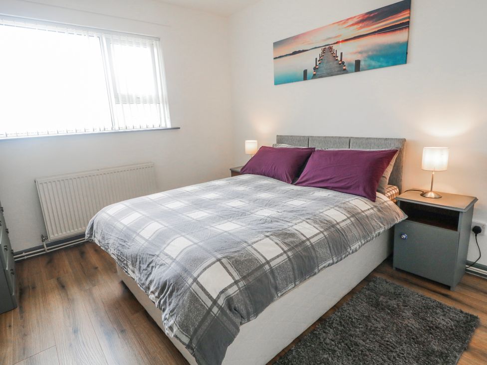 A bedroom with a bed and nightstands at The Island's View in Gortahork, County Donegal