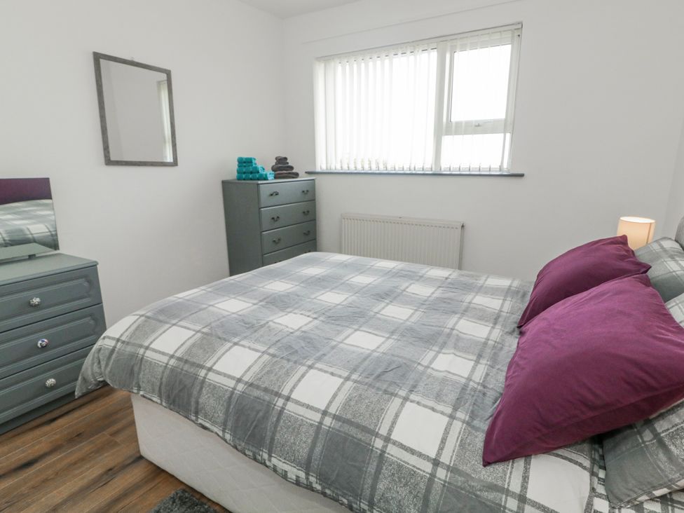 A bedroom with a bed and furniture at The Island's View in Gortahork, County Donegal