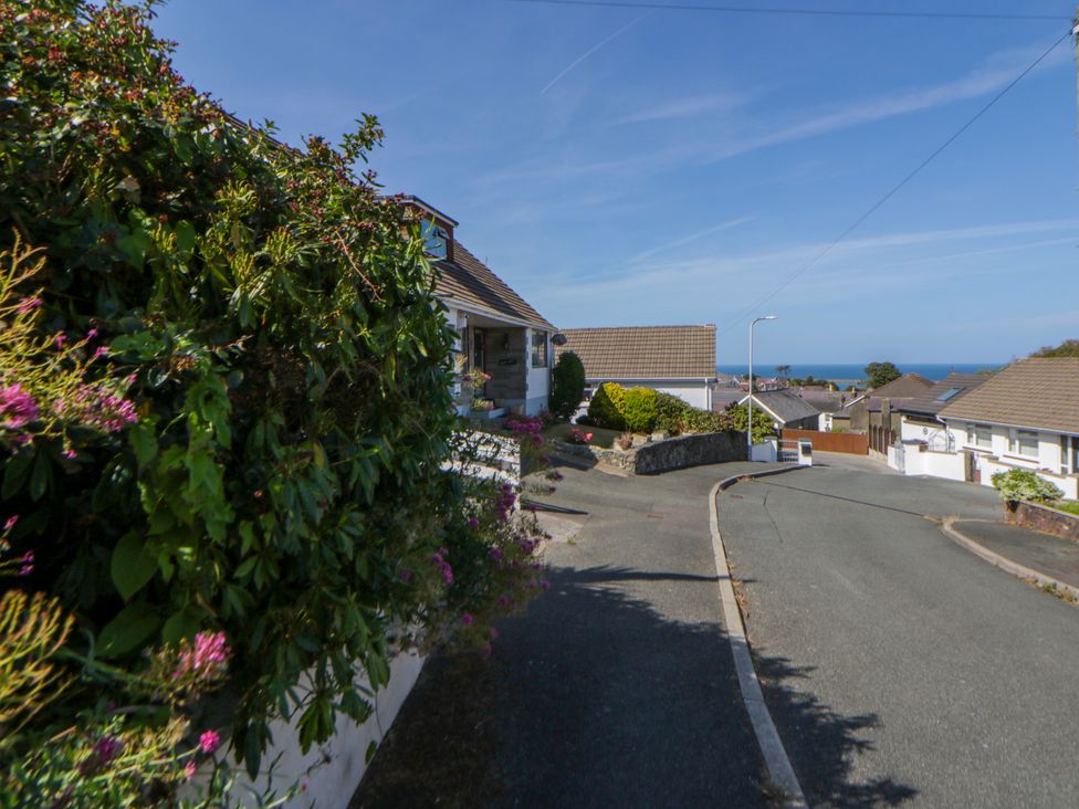 A view of a road with houses and sea visible at Harbour High Annex in Fishguard