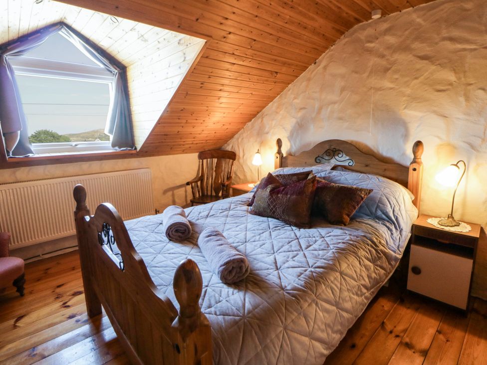 A bedroom with a bed and a window at Harbour High Annex in Fishguard