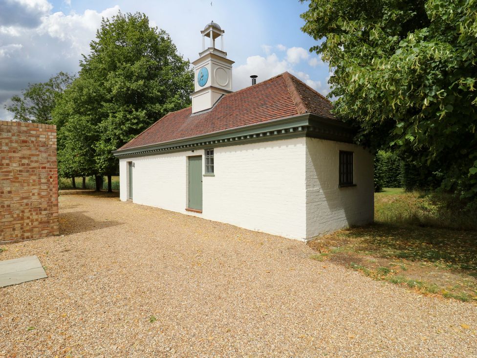 An outdoor area with a building featuring a clock tower at Clock Tower in Stowmarket