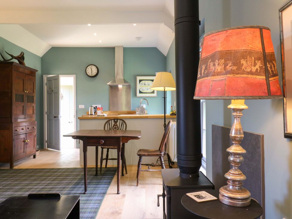 A kitchen with a table and chairs at Clock Tower in Stowmarket