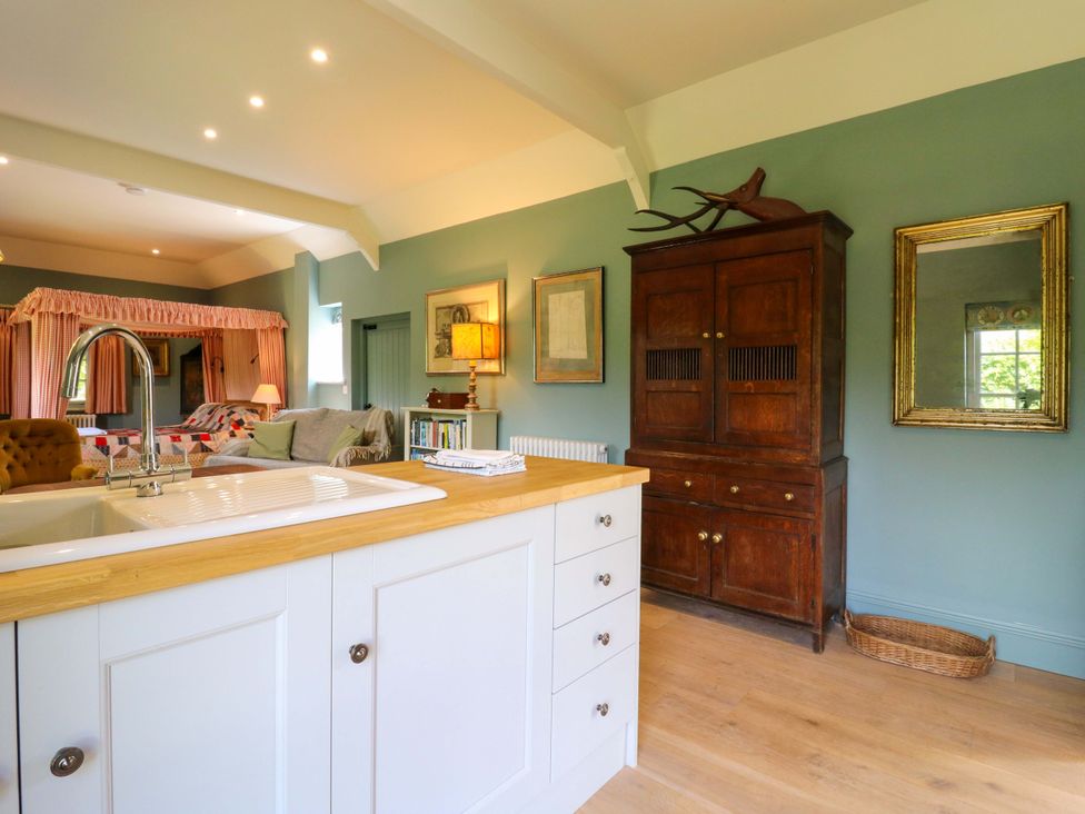 A kitchen with a sink and cupboard at Clock Tower in Stowmarket