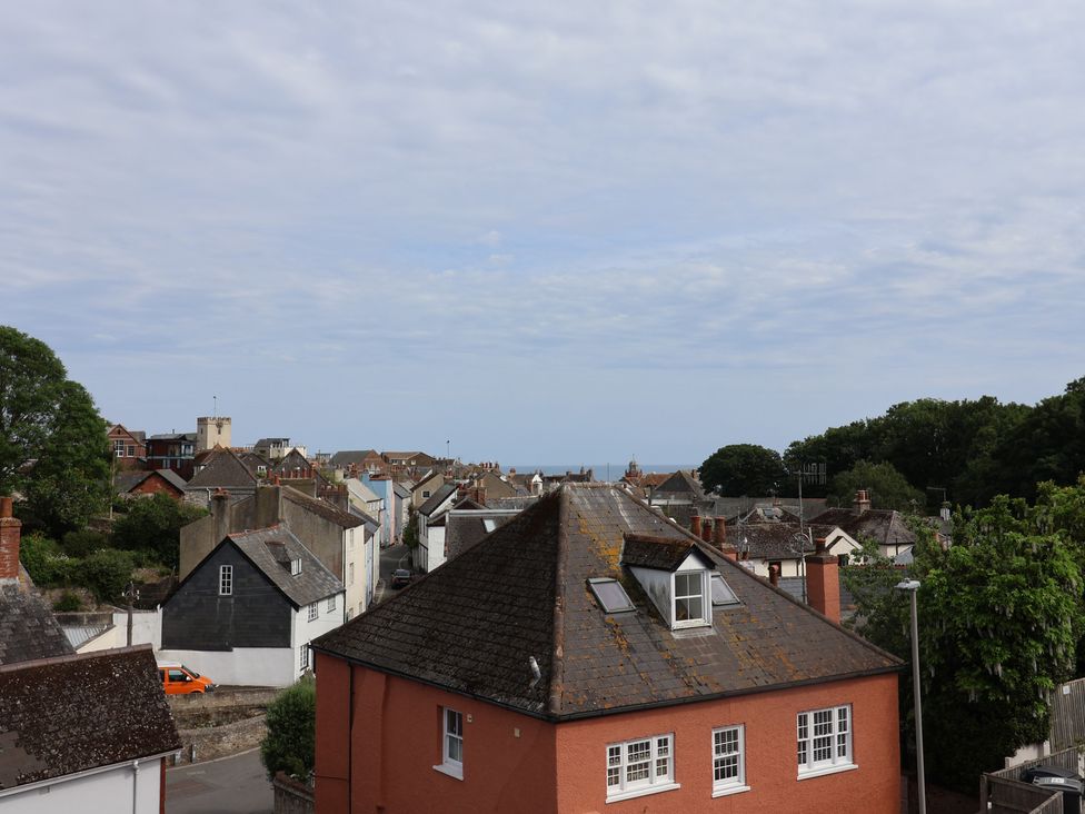 A view of rooftops and the sea at Wagtail Cottage in Lyme Regis