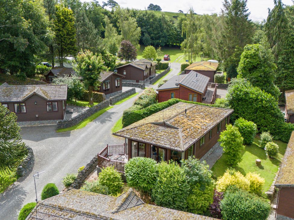 An aerial view of cabins and trees at Lodge 3 At Pound Farm Crook near Kendal