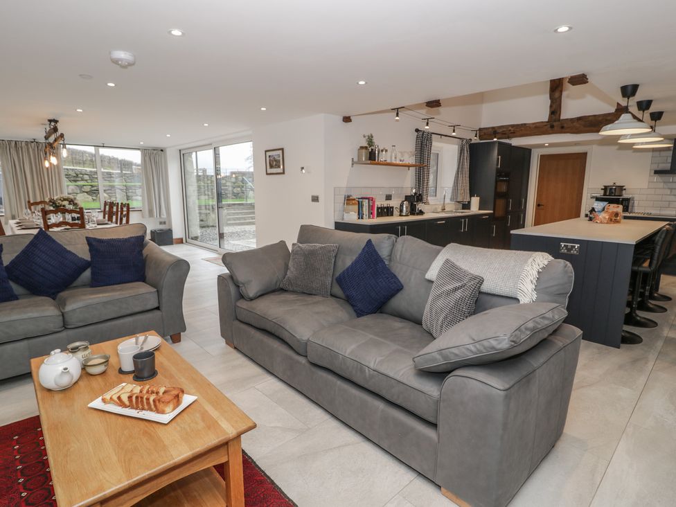 A living room with a sofa and coffee table at Y Côr in Cerrigydrudion