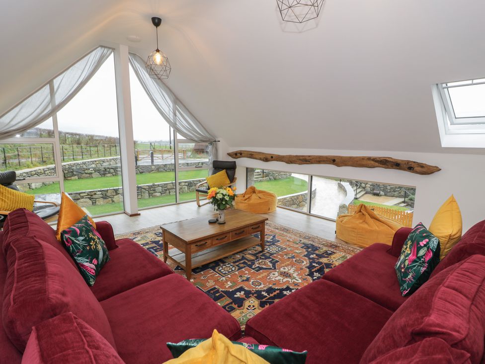 A living room with a coffee table and sofa at Y Côr in Cerrigydrudion