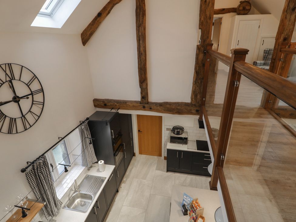 A kitchen with appliances and a sink at Y Côr in Cerrigydrudion