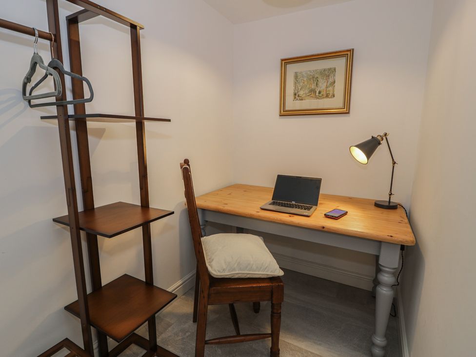 A study with a desk, chair, and laptop at Y Côr in Cerrigydrudion