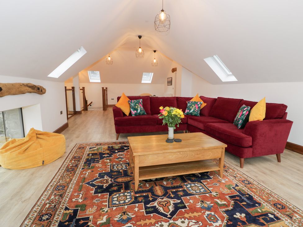 A living room with a sofa and coffee table at Y Côr in Cerrigydrudion