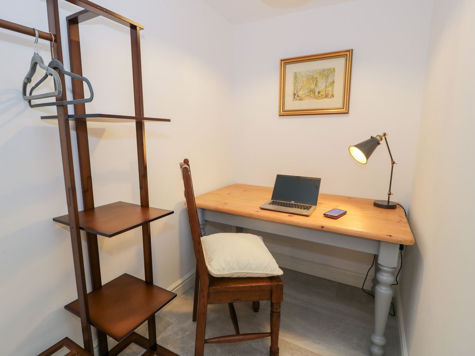 An office with a desk and laptop at Y Côr in Cerrigydrudion