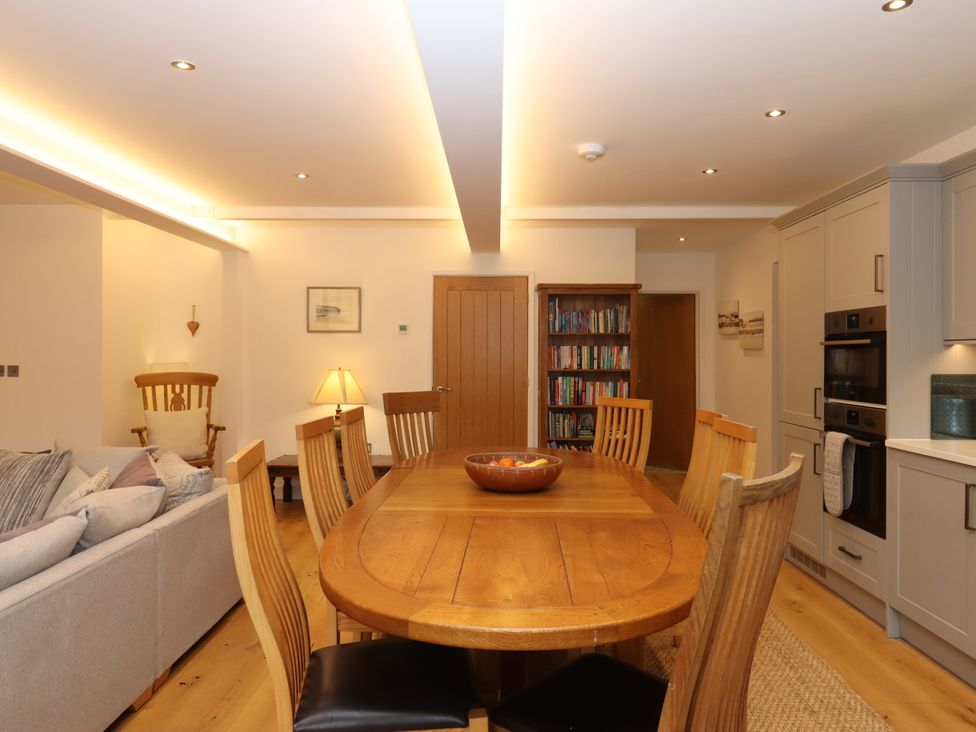 A dining room with a table and chairs at Lower Moorwood in Moorwood near Bovey Tracey