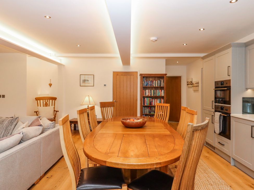 A dining area with a table and chairs at Lower Moorwood Moorwood near Bovey Tracey