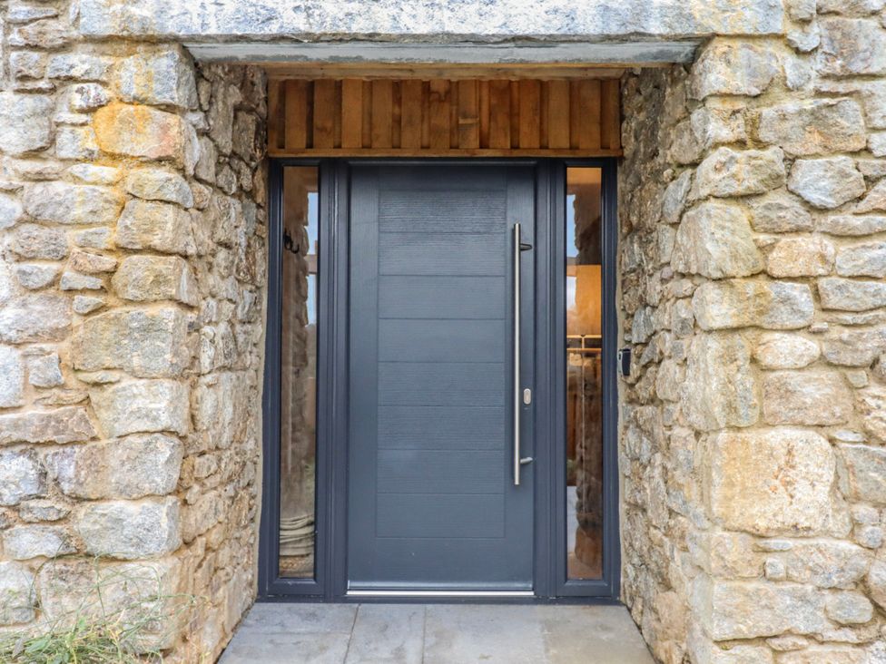 A front door with a stone wall at Lower Moorwood in Moorwood near Bovey Tracey