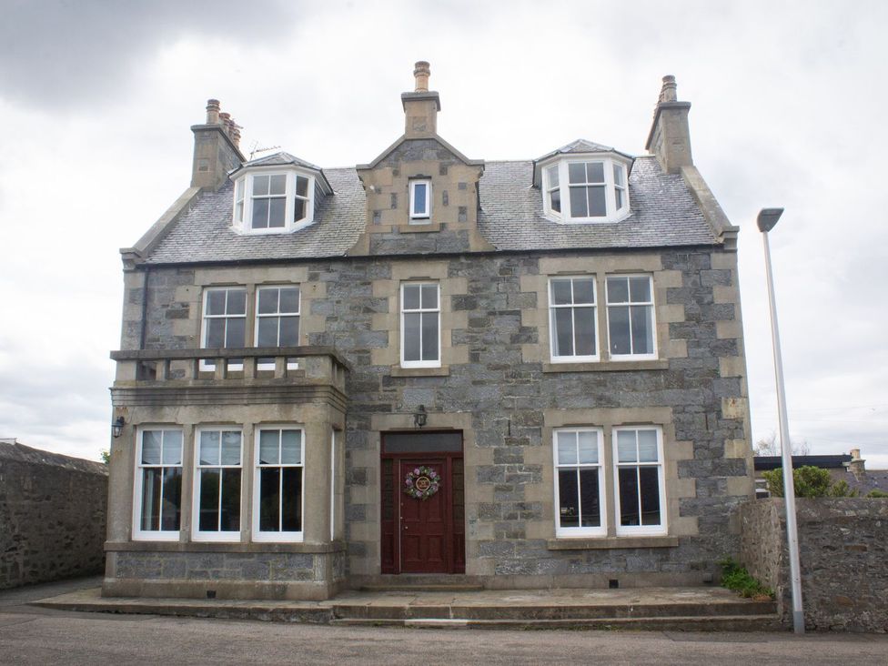 A house with multiple windows and a front door at Crannoch Self Catering Buckie