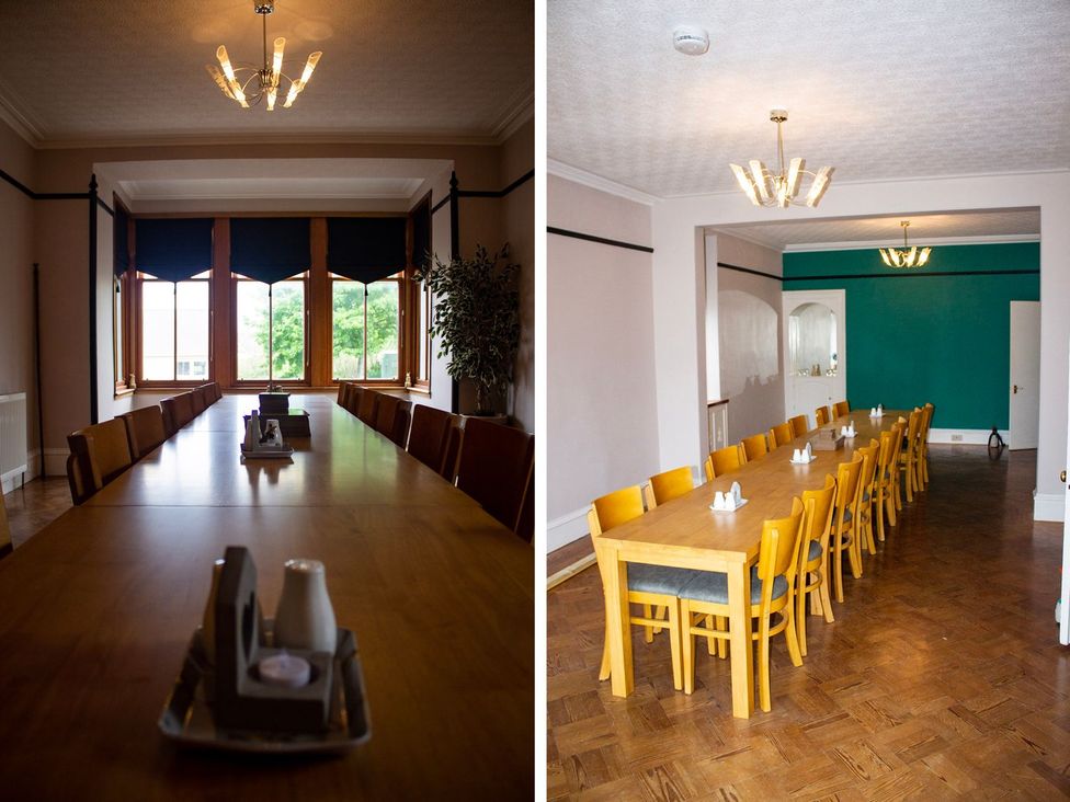 A dining room with a long table and chairs at Crannoch Self Catering in Buckie