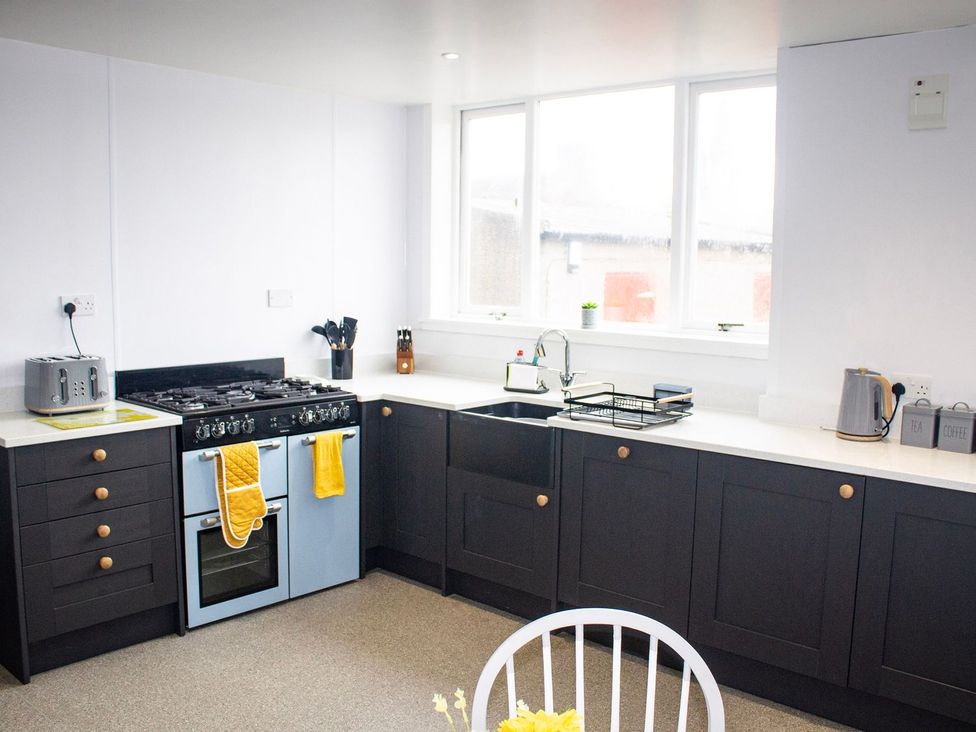 A kitchen with a stove and sink at Crannoch Self Catering Buckie