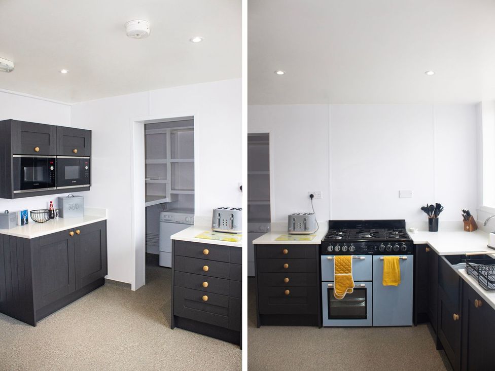 A kitchen with microwave, oven, and countertop at Crannoch Self Catering Buckie