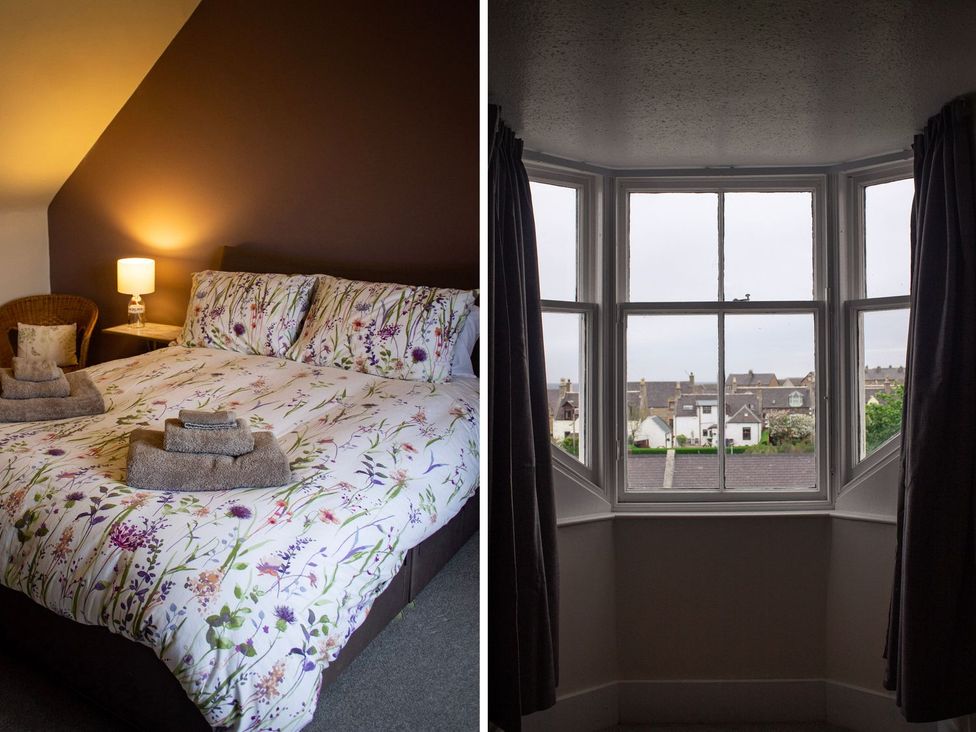 A bedroom with a bed and a window view at Crannoch Self Catering in Buckie