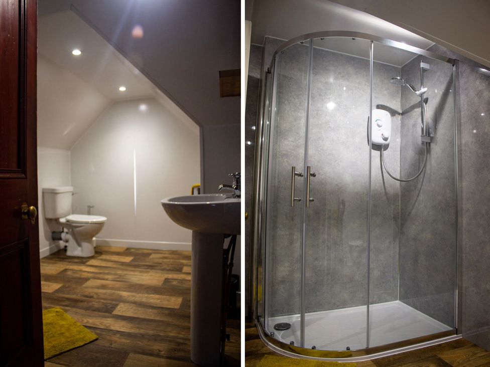 A bathroom with a toilet, sink, and shower at Crannoch Self Catering in Buckie