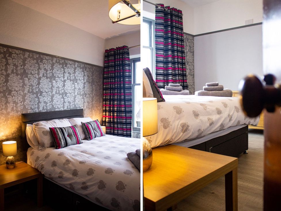 A bedroom with a bed and lamp at Crannoch Self Catering in Buckie