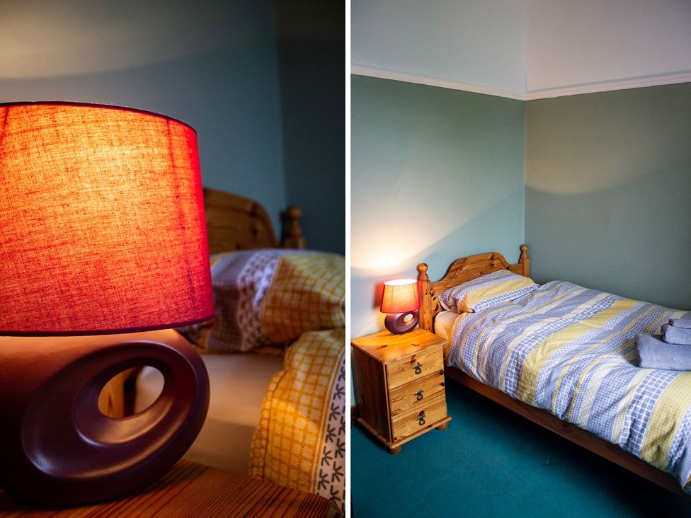 A bedroom with a bed and lamp at Crannoch Self Catering in Buckie