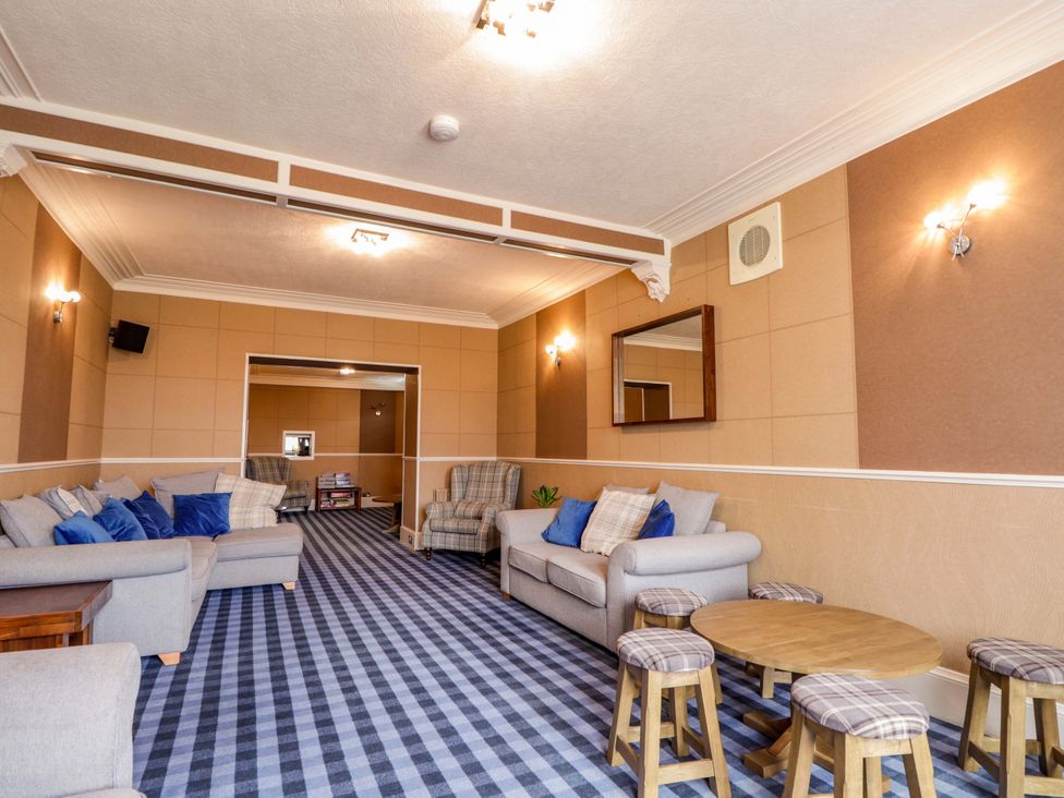 A living room with seating and a coffee table at Crannoch Self Catering, Cullen