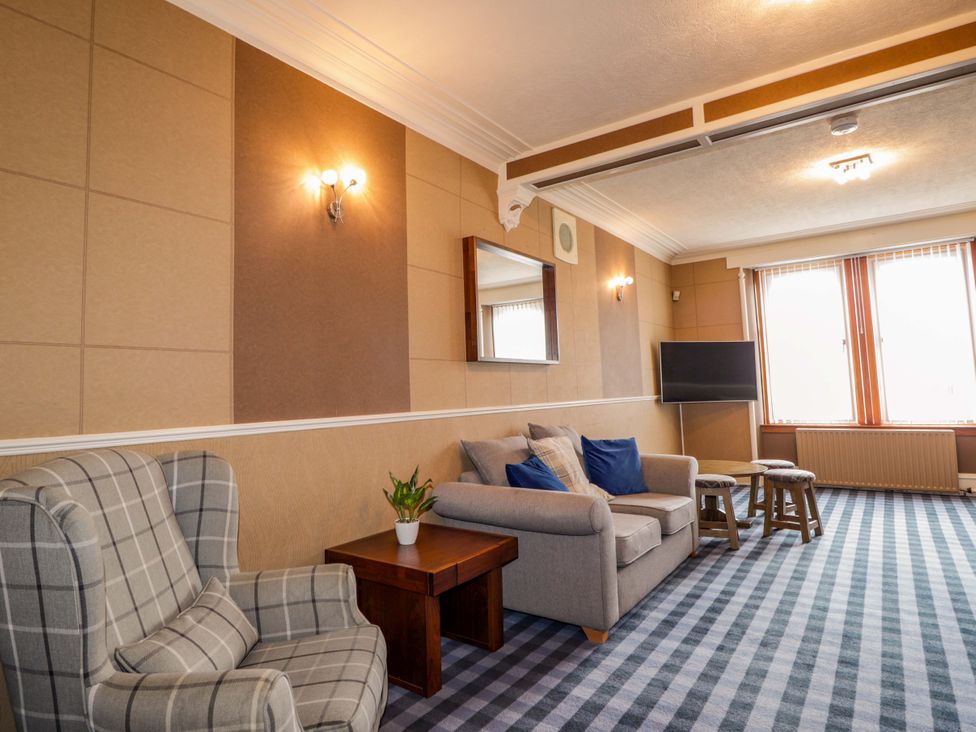 A living room with a sofa and armchair at Crannoch Self Catering in Cullen