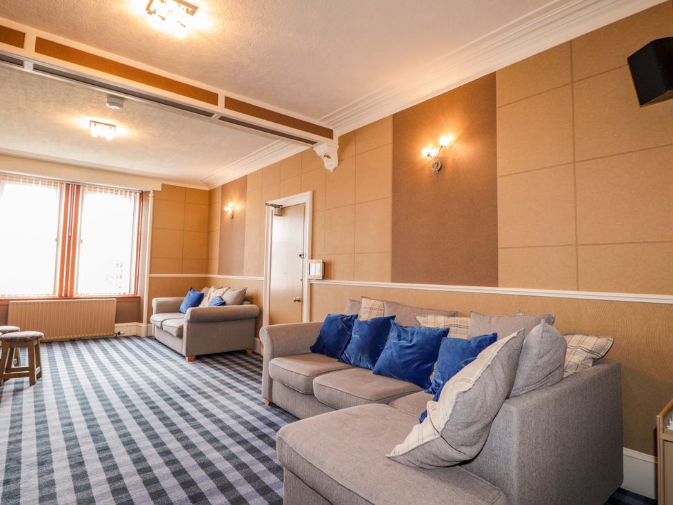 A living room with sofas and a table at Crannoch Self Catering in Cullen