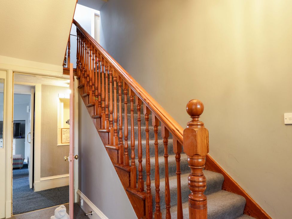 A staircase in a hallway at Crannoch Self Catering in Cullen