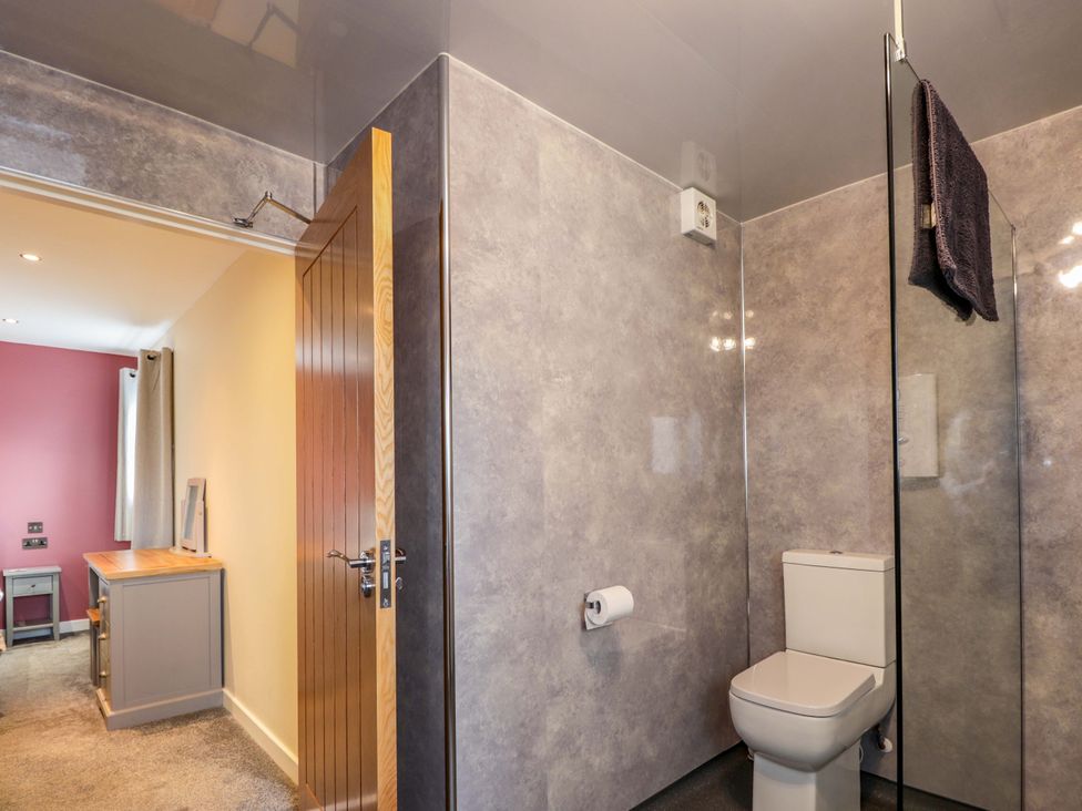 A bathroom with a shower and toilet at Crannoch Self Catering in Cullen